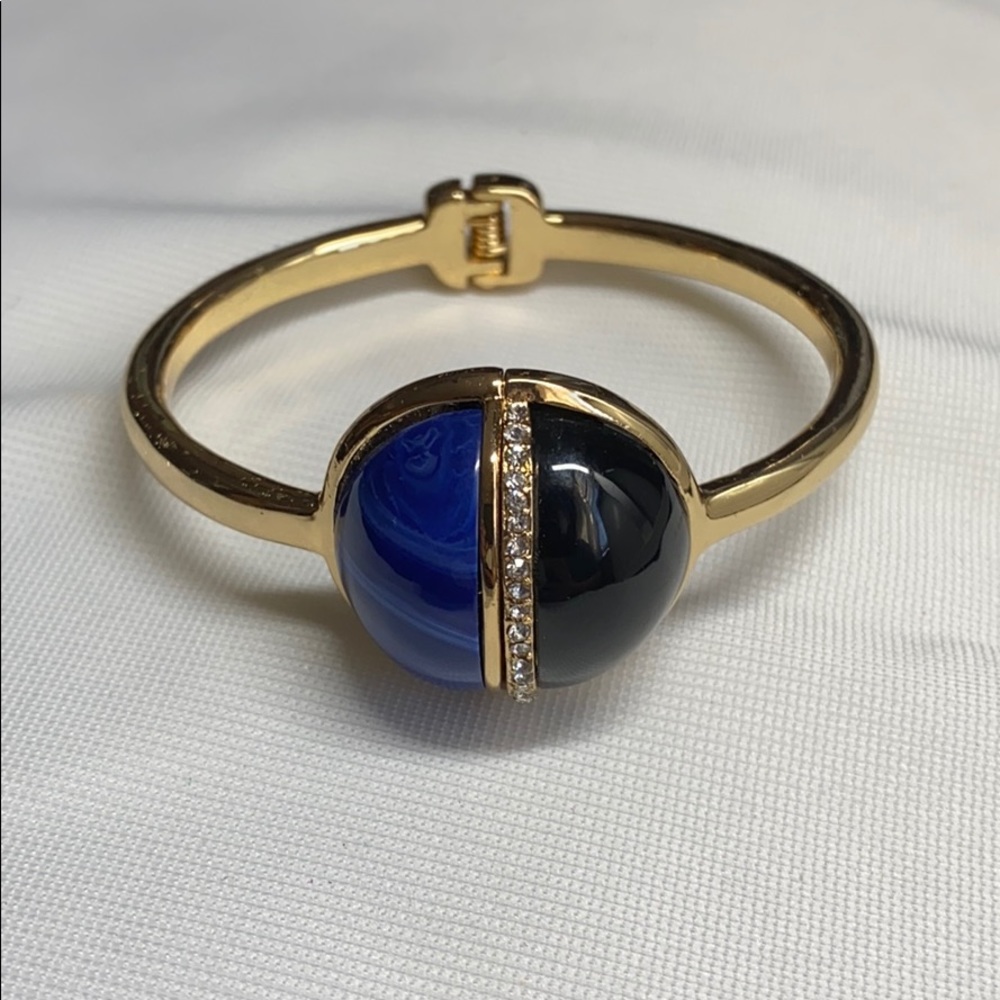 Gold tone hinged bracelet